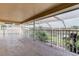 Spacious screened lanai boasts views of the lush landscaping and tranquil lake at 3322 Cypress Landing Dr, Valrico, FL 33596