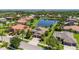 Beautiful home with well-manicured lawns, beautiful trees, and landscaping in a Gathering-friendly, serene, lakeside community at 347 Cockle Shell Loop, Apollo Beach, FL 33572