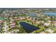 Beautiful aerial view of a residential community with lakefront homes and lush green landscaping at 347 Cockle Shell Loop, Apollo Beach, FL 33572
