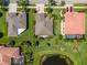 Overhead view of a single Gathering home with a well manicured lawn, mature landscaping, and an inviting driveway entrance at 347 Cockle Shell Loop, Apollo Beach, FL 33572