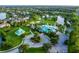 Aerial view of a community with lakefront homes, community center, playgrounds and more at 347 Cockle Shell Loop, Apollo Beach, FL 33572