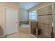 The primary bathroom features a walk-in shower, a garden tub, and tiled floors at 347 Cockle Shell Loop, Apollo Beach, FL 33572