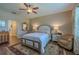 Traditional Primary bedroom with wood flooring, a ceiling fan, and a decorative rug at 347 Cockle Shell Loop, Apollo Beach, FL 33572