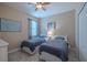 Featuring two twin beds, carpeted floors, and a ceiling fan at 347 Cockle Shell Loop, Apollo Beach, FL 33572