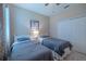 Featuring two twin beds, carpeted floors, and a ceiling fan at 347 Cockle Shell Loop, Apollo Beach, FL 33572