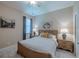 This is a traditionally decorated bedroom with neutral colors and carpeted floors at 347 Cockle Shell Loop, Apollo Beach, FL 33572