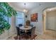 Inviting breakfast nook with a round table, four chairs, and natural light at 347 Cockle Shell Loop, Apollo Beach, FL 33572