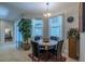 Inviting breakfast nook with a round table, four chairs, and natural light at 347 Cockle Shell Loop, Apollo Beach, FL 33572