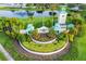 Entrance of community with beautiful fountain and landscaping with Harbour Isles sign at 347 Cockle Shell Loop, Apollo Beach, FL 33572
