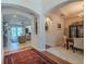 Open-concept foyer leading to living and dining spaces, showcasing modern design and bright lighting at 347 Cockle Shell Loop, Apollo Beach, FL 33572