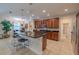 Open kitchen with a large island, pendant lighting, and stainless steel appliances and breakfast nook at 347 Cockle Shell Loop, Apollo Beach, FL 33572