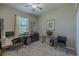 Bright office with a ceiling fan, a carpet flooring, and a work desk at 347 Cockle Shell Loop, Apollo Beach, FL 33572