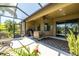 Enclosed patio features outdoor seating, ceiling fan, and a large grill at 347 Cockle Shell Loop, Apollo Beach, FL 33572