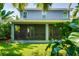 Exterior view of home from backyard with a beautiful screened-in patio at 3714 W San Juan St, Tampa, FL 33629