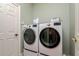 Modern laundry room featuring a front-load washer and dryer at 3714 W San Juan St, Tampa, FL 33629