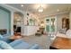 Inviting living room featuring a built-in bar, an area rug, and hardwood floors at 3714 W San Juan St, Tampa, FL 33629