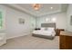 Serene main bedroom with tray ceilings, neutral walls, and ample natural light at 3714 W San Juan St, Tampa, FL 33629