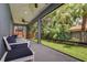 Inviting screened porch with comfortable seating overlooking a lush green yard at 3714 W San Juan St, Tampa, FL 33629