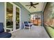 Screened in back porch with ceiling fan and outdoor seating, perfect for relaxing at 3714 W San Juan St, Tampa, FL 33629