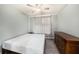 This bedroom has a ceiling fan, light gray walls, and a bamboo designed mattress on the bed frame at 4221 W Spruce St # 2104, Tampa, FL 33607