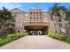 Beautiful building featuring covered parking and stone accents, creating a blend of convenience and elegant curb appeal at 4221 W Spruce St # 2104, Tampa, FL 33607