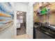 A organized laundry room features modern washer/dryer, ample shelving and storage, for efficient home management at 4221 W Spruce St # 2104, Tampa, FL 33607