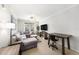 Bright living room with tile floors, neutral walls, modern furniture, and natural light at 4221 W Spruce St # 2104, Tampa, FL 33607