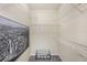 Spacious walk-in closet features wire shelving and city themed wall art for maximum storage and organization at 4221 W Spruce St # 2104, Tampa, FL 33607