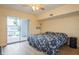 Spacious bedroom featuring sliding glass doors and a ceiling fan at 4325 58Th N Way # 1527, Kenneth City, FL 33709