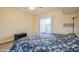Bright bedroom with sliding glass doors and a ceiling fan at 4325 58Th N Way # 1527, Kenneth City, FL 33709