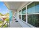Exterior corridor view of a two-story residential building, accessible units, and convenient parking nearby at 4325 58Th N Way # 1527, Kenneth City, FL 33709