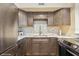 Well-appointed kitchen with stainless appliances, granite counters, and tiled backsplash offers style and functionality at 4325 58Th N Way # 1527, Kenneth City, FL 33709