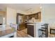 Modern kitchen with stainless steel appliances and a stylish breakfast bar provides a functional and elegant space at 4325 58Th N Way # 1527, Kenneth City, FL 33709