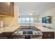 Stylish kitchen with granite counters, stainless oven, and open layout offers a perfect space for culinary creations at 4325 58Th N Way # 1527, Kenneth City, FL 33709