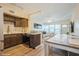 Bright eat-in kitchen features stainless steel appliances, wood cabinets, a tiled backsplash, and a cozy dining area at 4325 58Th N Way # 1527, Kenneth City, FL 33709