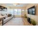 Bright living room offers a relaxing setting with natural light, a wall-mounted TV, and stylish accents at 4325 58Th N Way # 1527, Kenneth City, FL 33709