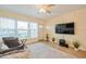 Cozy living room with natural light, sleek TV setup, and a modern rug creates a welcoming atmosphere at 4325 58Th N Way # 1527, Kenneth City, FL 33709