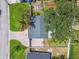Aerial view of a home showcasing its roof, driveway, and landscaped surroundings at 4400 Helena Ne St, St Petersburg, FL 33703