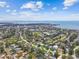 Wide aerial shot captures a dense neighborhood with waterfront access and various architectural styles at 4400 Helena Ne St, St Petersburg, FL 33703