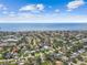 Breathtaking aerial view of a coastal community featuring a mix of residential homes and the vast ocean at 4400 Helena Ne St, St Petersburg, FL 33703