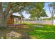 Overhead view of a backyard featuring a covered patio and mature shade tree at 4400 Helena Ne St, St Petersburg, FL 33703