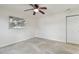 Bedroom featuring a bright window, ceiling fan and door to hall at 4400 Helena Ne St, St Petersburg, FL 33703