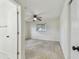 Bright bedroom with ceiling fan, and view from the doorway at 4400 Helena Ne St, St Petersburg, FL 33703