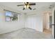 Bright bedroom featuring a ceiling fan and a double-door closet at 4400 Helena Ne St, St Petersburg, FL 33703