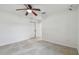 Bedroom with closet, ceiling fan, and a bright, sunny window at 4400 Helena Ne St, St Petersburg, FL 33703