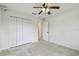 Bright bedroom featuring a ceiling fan and a double-door closet at 4400 Helena Ne St, St Petersburg, FL 33703