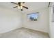 A cozy bedroom featuring bright white walls and a ceiling fan at 4400 Helena Ne St, St Petersburg, FL 33703