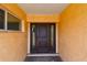 Inviting front entrance featuring a dark wood door with sidelights and a brick paver landing area at 4400 Helena Ne St, St Petersburg, FL 33703