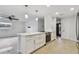 Bright, renovated kitchen with a center island, modern appliances, and open layout to the living area at 4400 Helena Ne St, St Petersburg, FL 33703