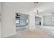 Spacious open-concept living room features light-filled interiors and ceiling fans at 4400 Helena Ne St, St Petersburg, FL 33703